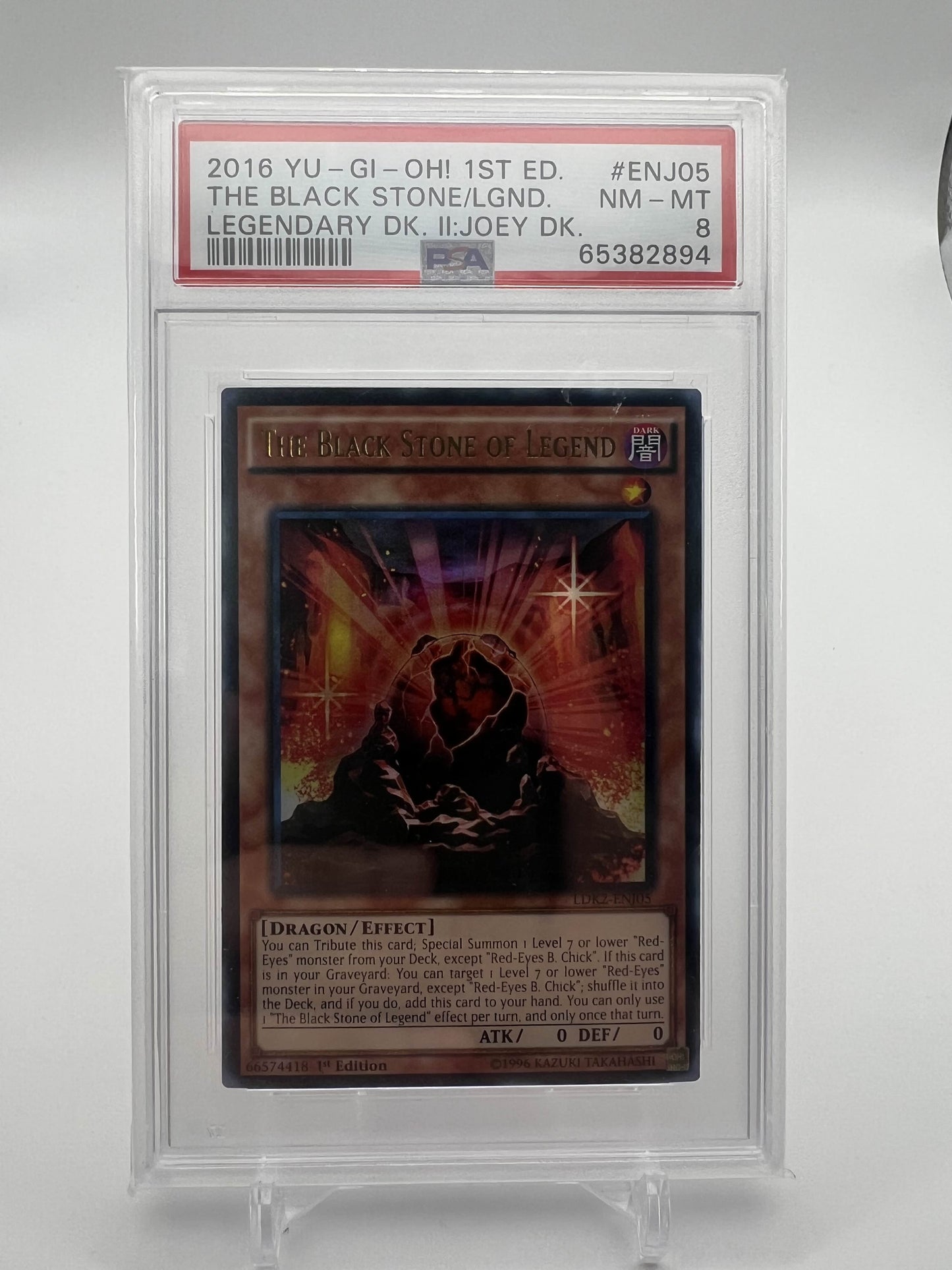 2016 YU-GI-OH! 1ST ED. THE BLACK STONE/LGND. LEGENDARY DK. II:JOEY DK. PSA 8