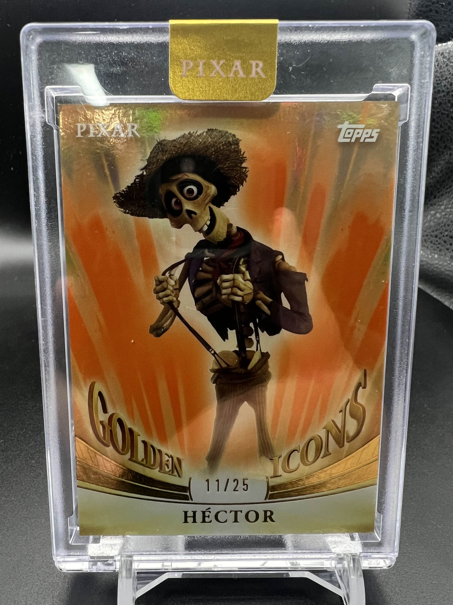 2025 Topps Pixar Gold Hector Golden Icons (Encased) 11/25 #GI-70